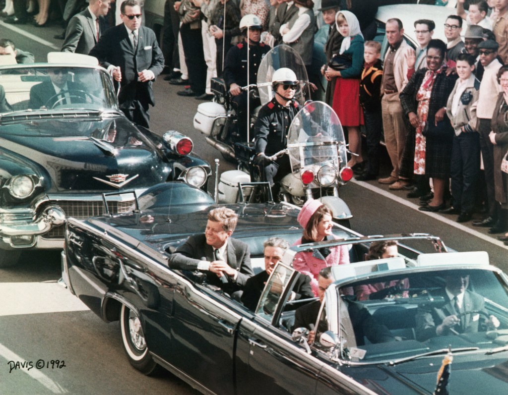 President and Mrs. Kennedy in a motorcade in Dallas.