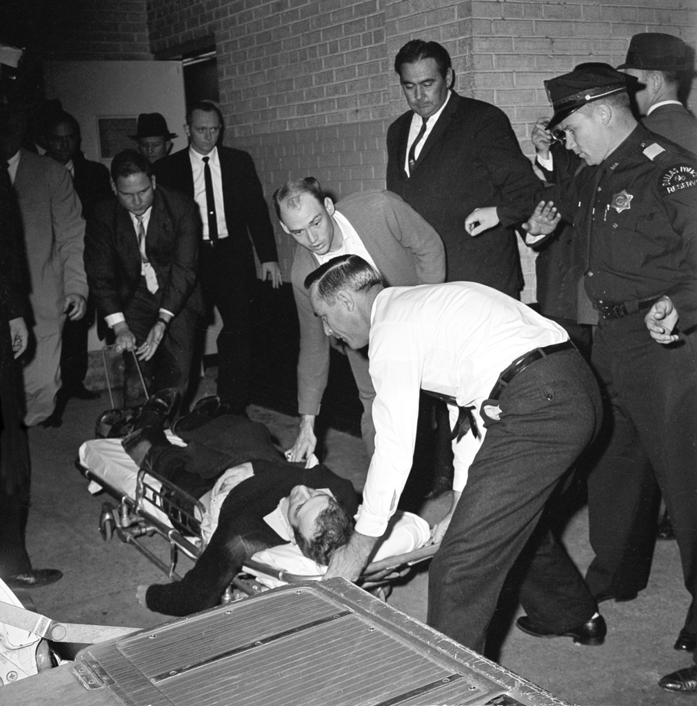 Lee Harvey Oswald on a stretcher after being shot.