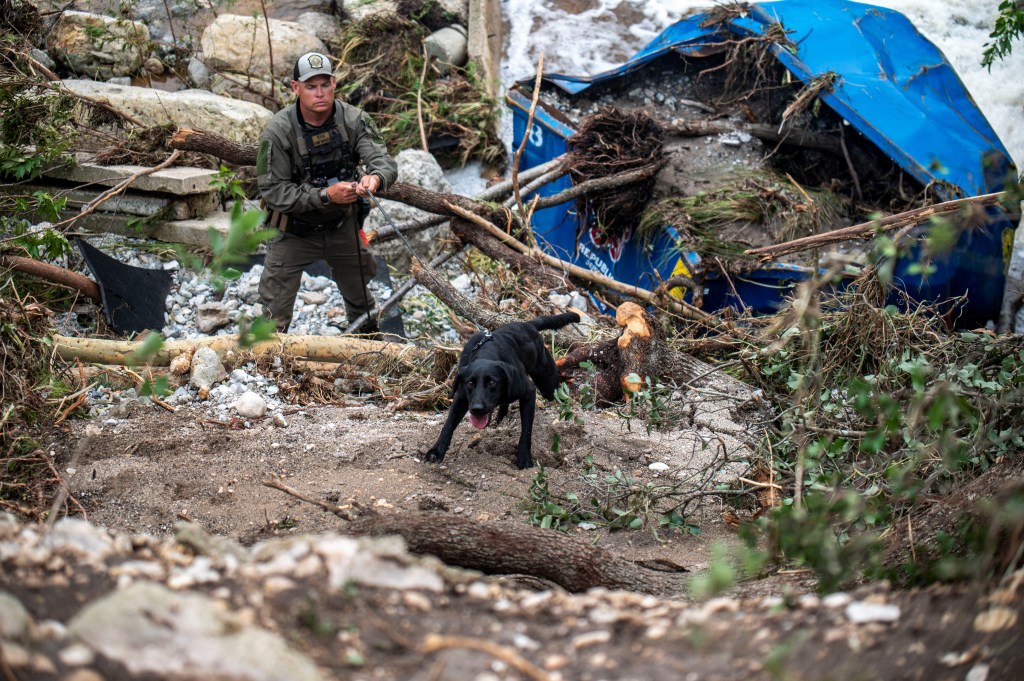 Search dog and handler at flood site in Kerr County, Texas.