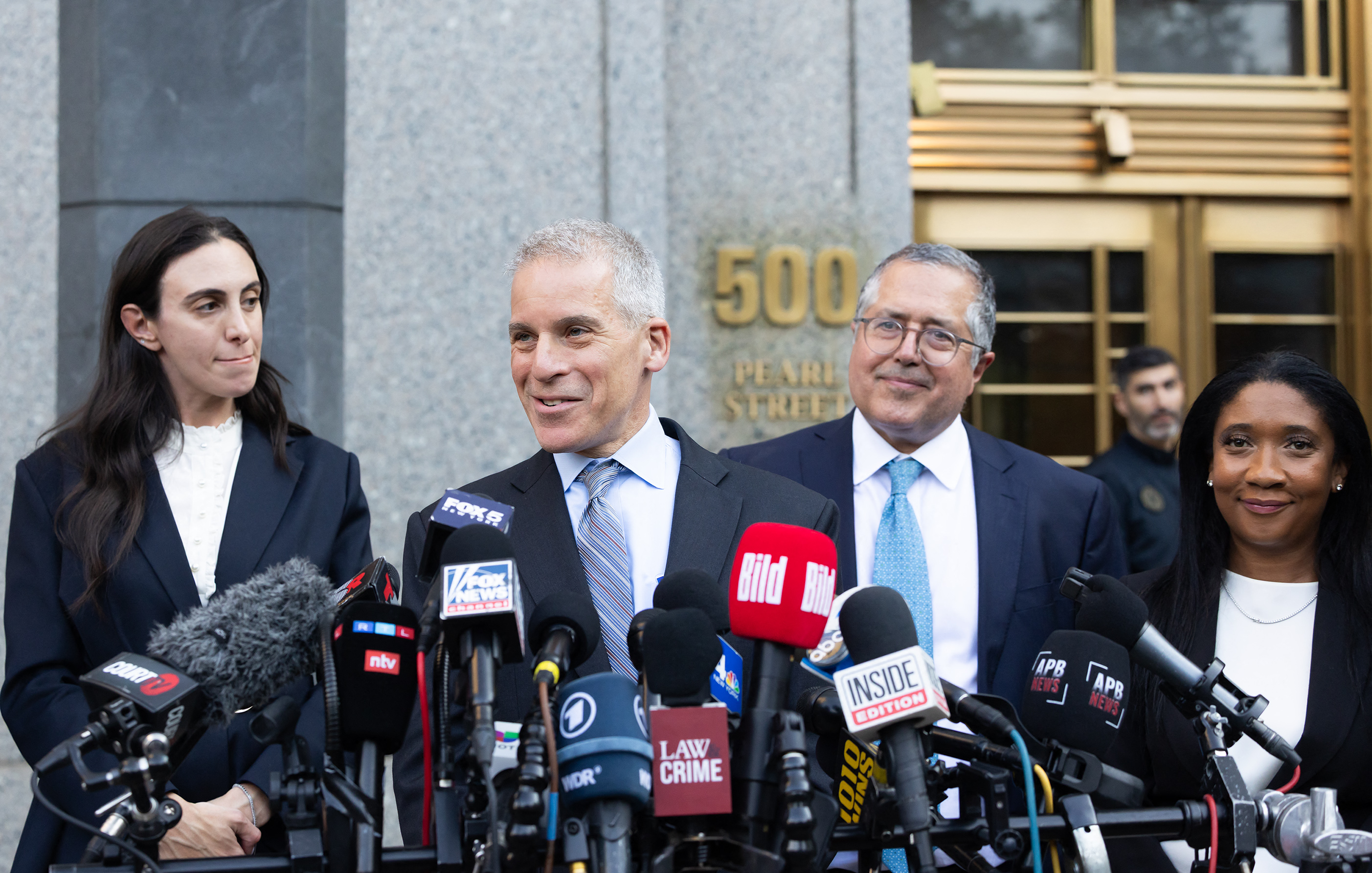 Marc Agnifilo and Teny Geragos speaking to reporters in 2025