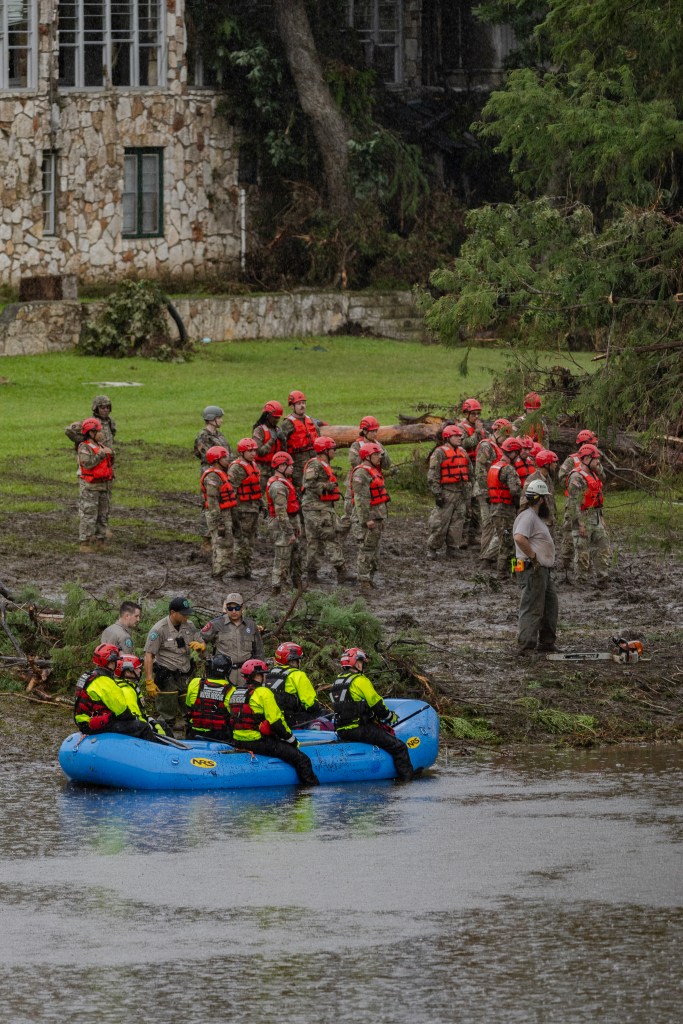 Rescue workers in a raft at a flood site.
