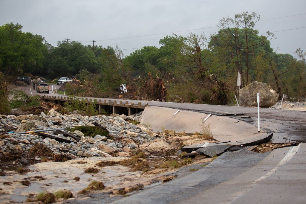 Damaged road and bridge after a flash flood in Kerrville, Texas.