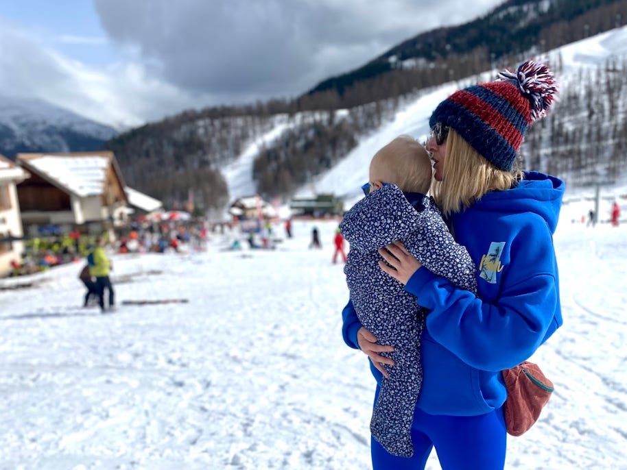 The writer and her child in the snowy Alps.
