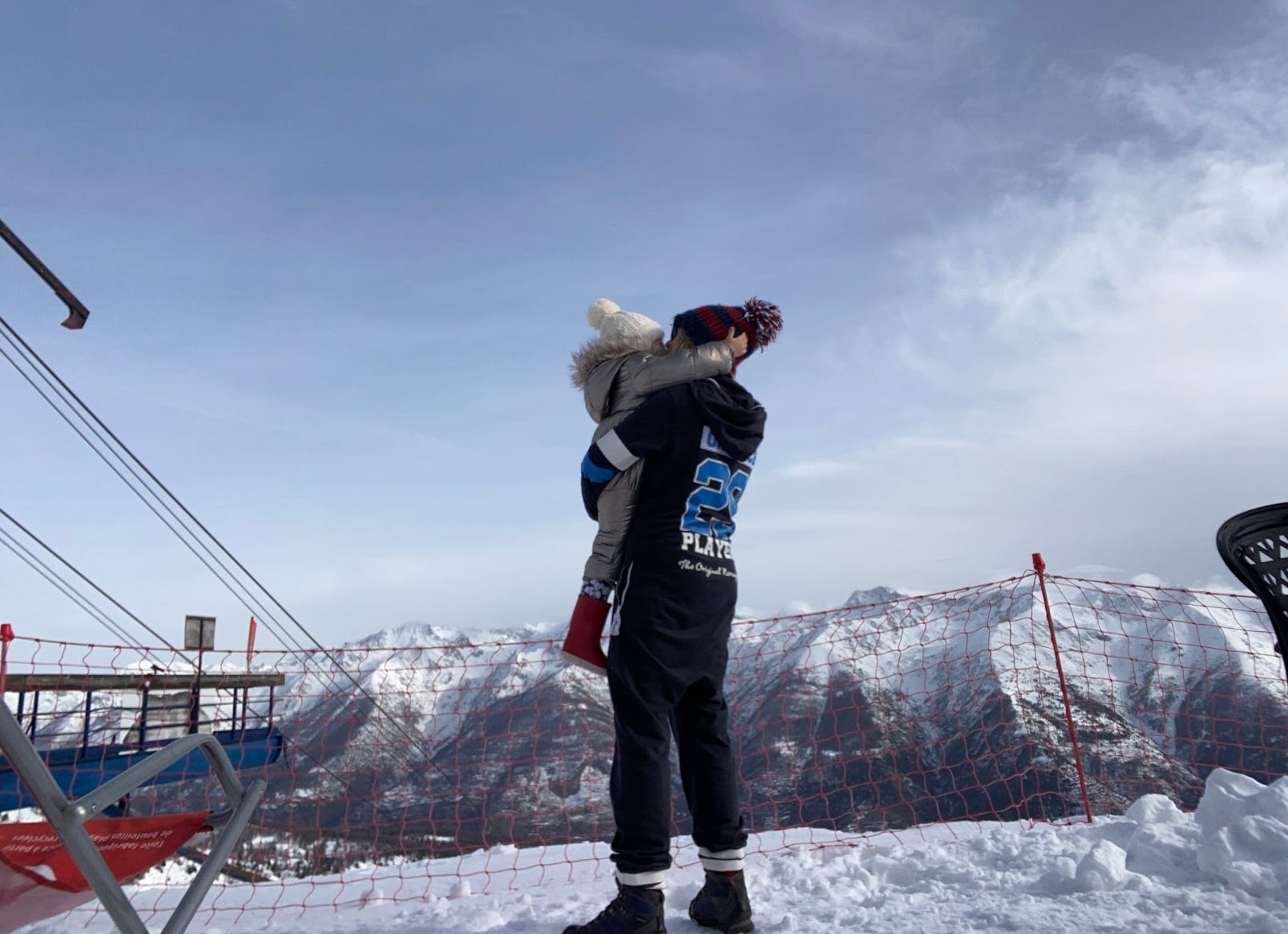The author holding her child near the Alps in France.