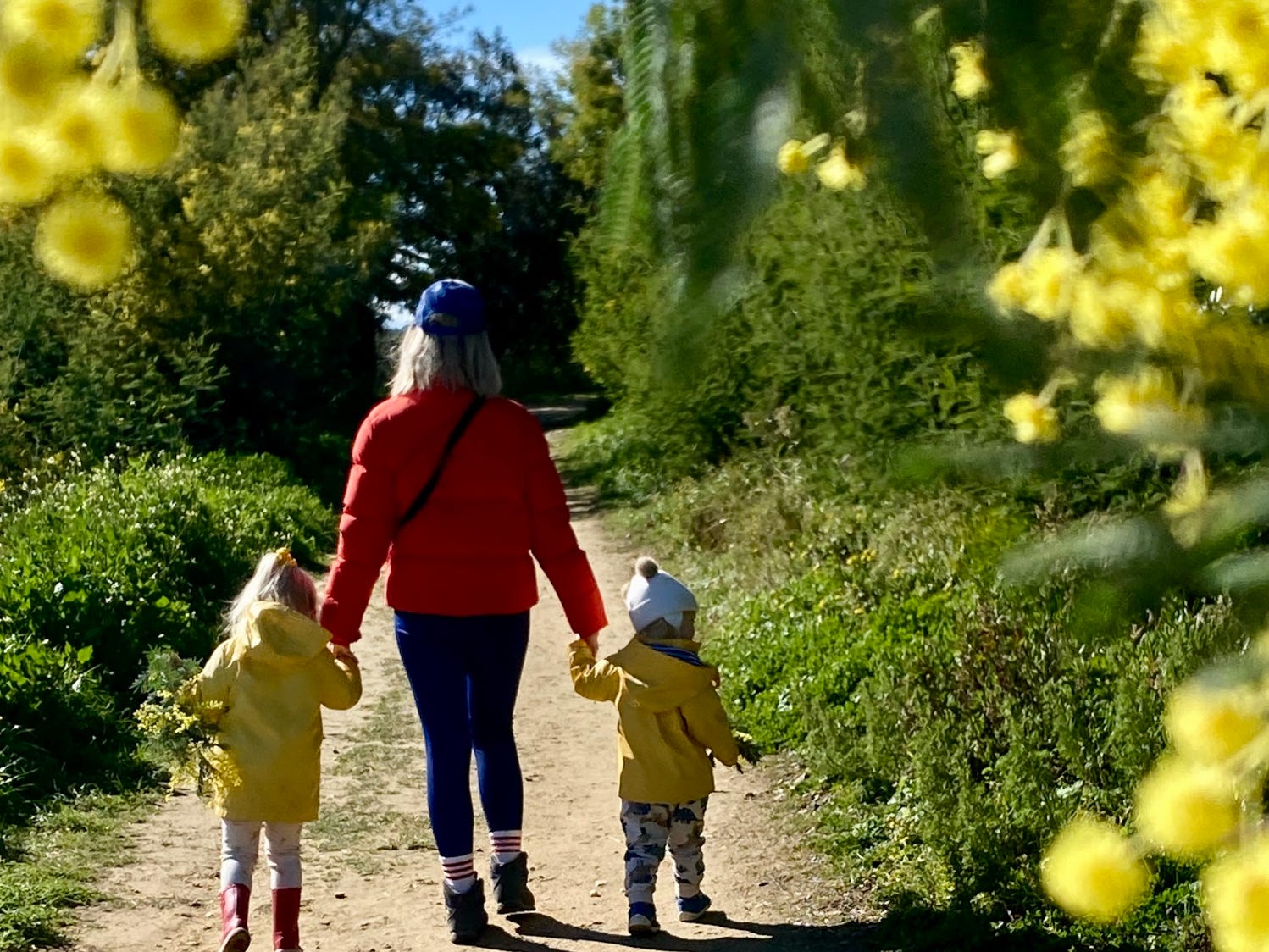 The writer and her kids walking a trail in France.