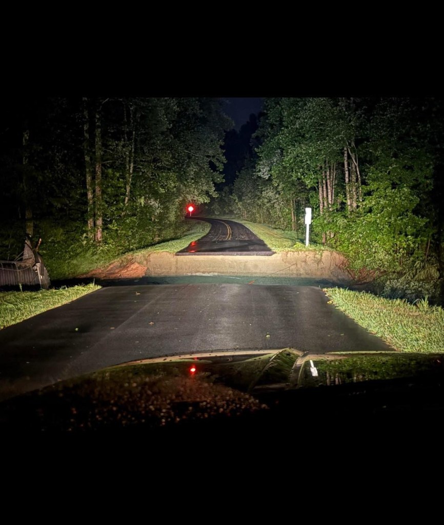 Nighttime view of a flooded road in North Carolina.
