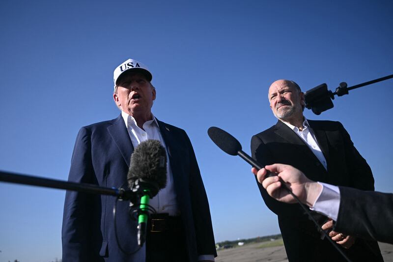 President Donald Trump standing alongside Commerce Secretary Howard Lutnick on July 6, 2025, insisted that cuts to staffing at the National Weather Service did not have an impact on the deadly flooding in Texas as officials there said they did not know what was coming before the disaster.