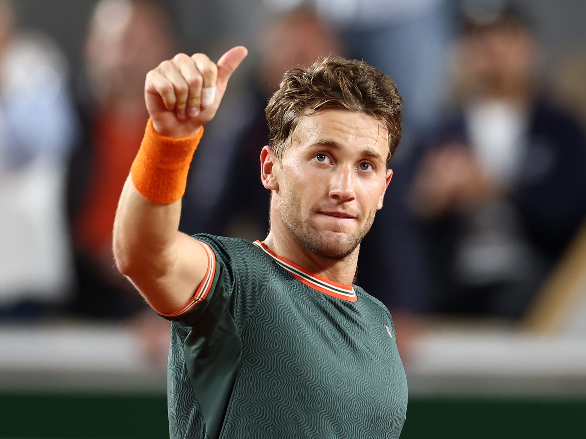 Casper Ruud of Denmark celebrates winning match point against Taylor Fritz of United States in the Men's Singles fourth round match during Day Nine of the 2024 French Open