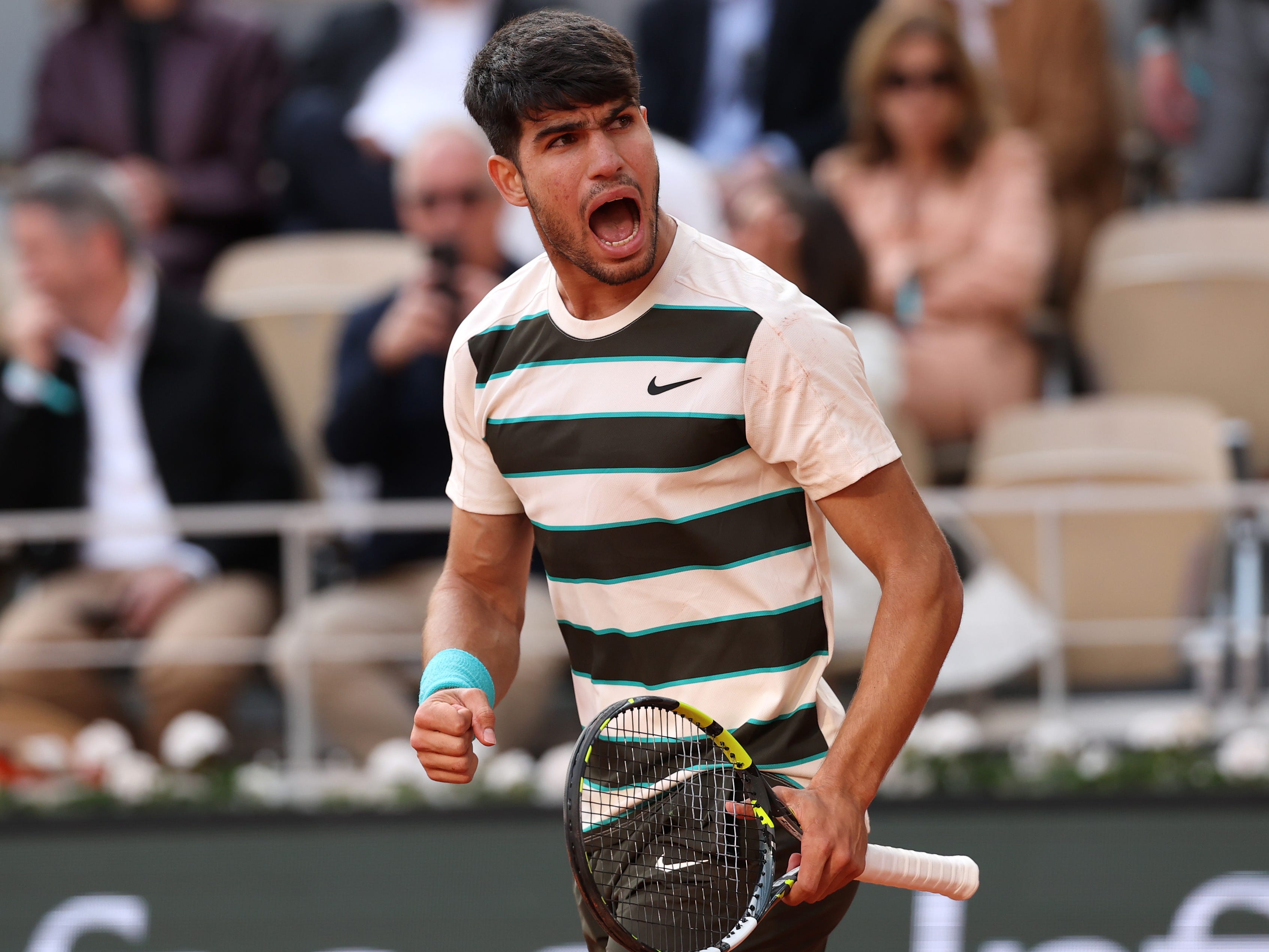Carlos Alcaraz of Spain celebrates a point against Jannik Sinner of Italy during the Men's Singles Final match on Day Fifteen of the 2025 French Open at Roland Garros on June 08, 2025 in Paris, France.