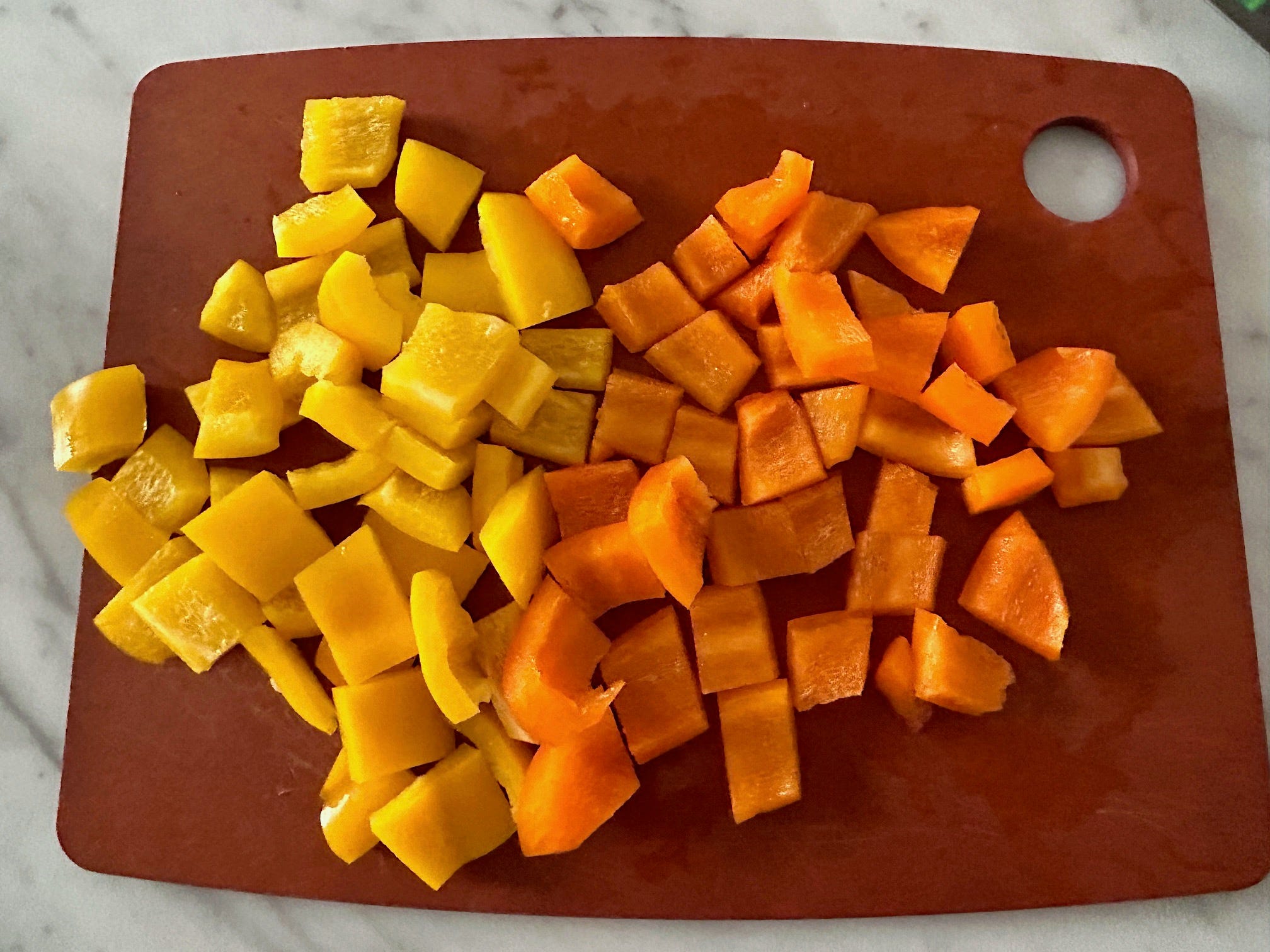 Chopping veggies for Ina Garten's Greek panzanella salad