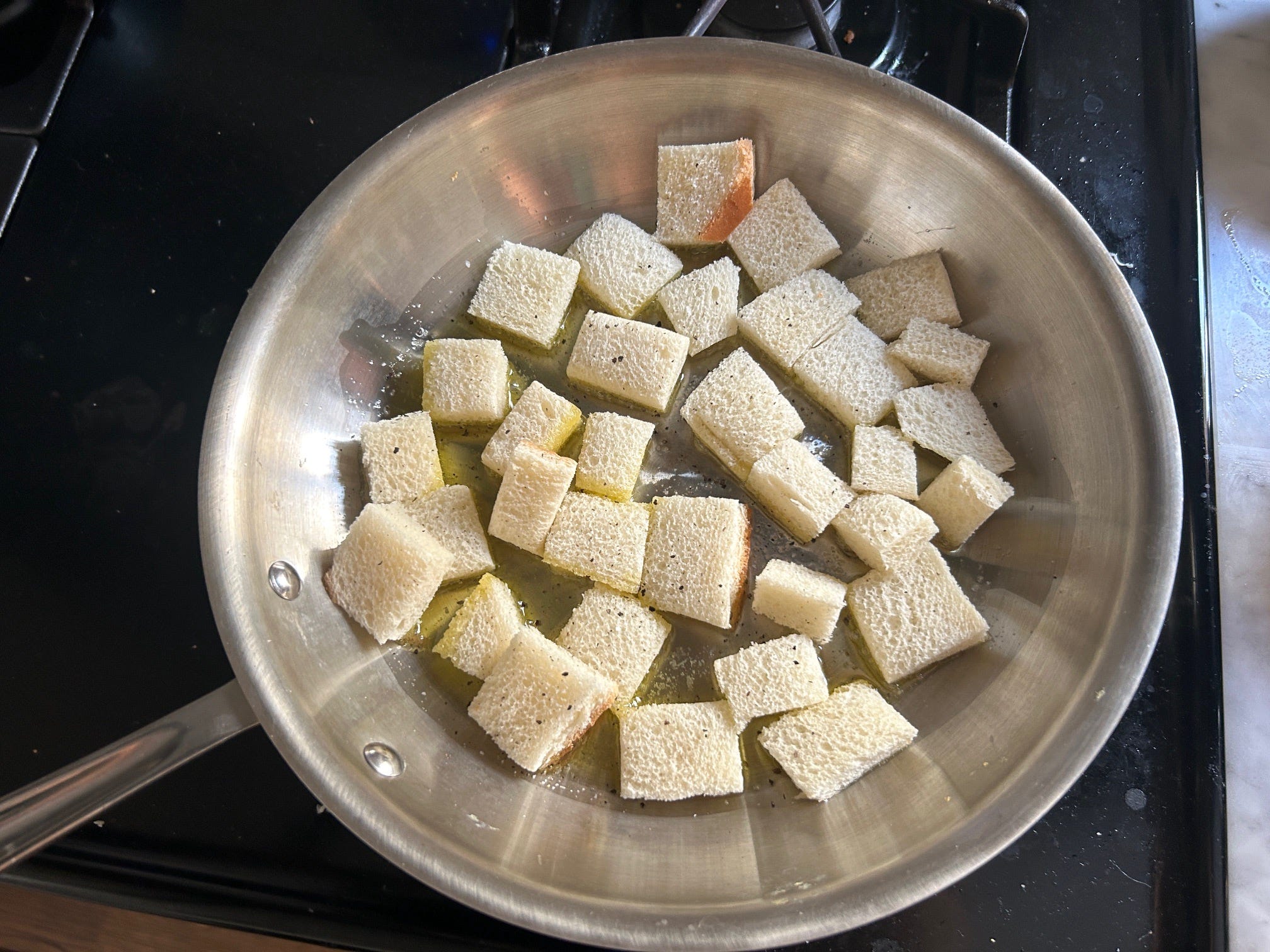 Making croutons for Ina Garten's Greek panzanella salad