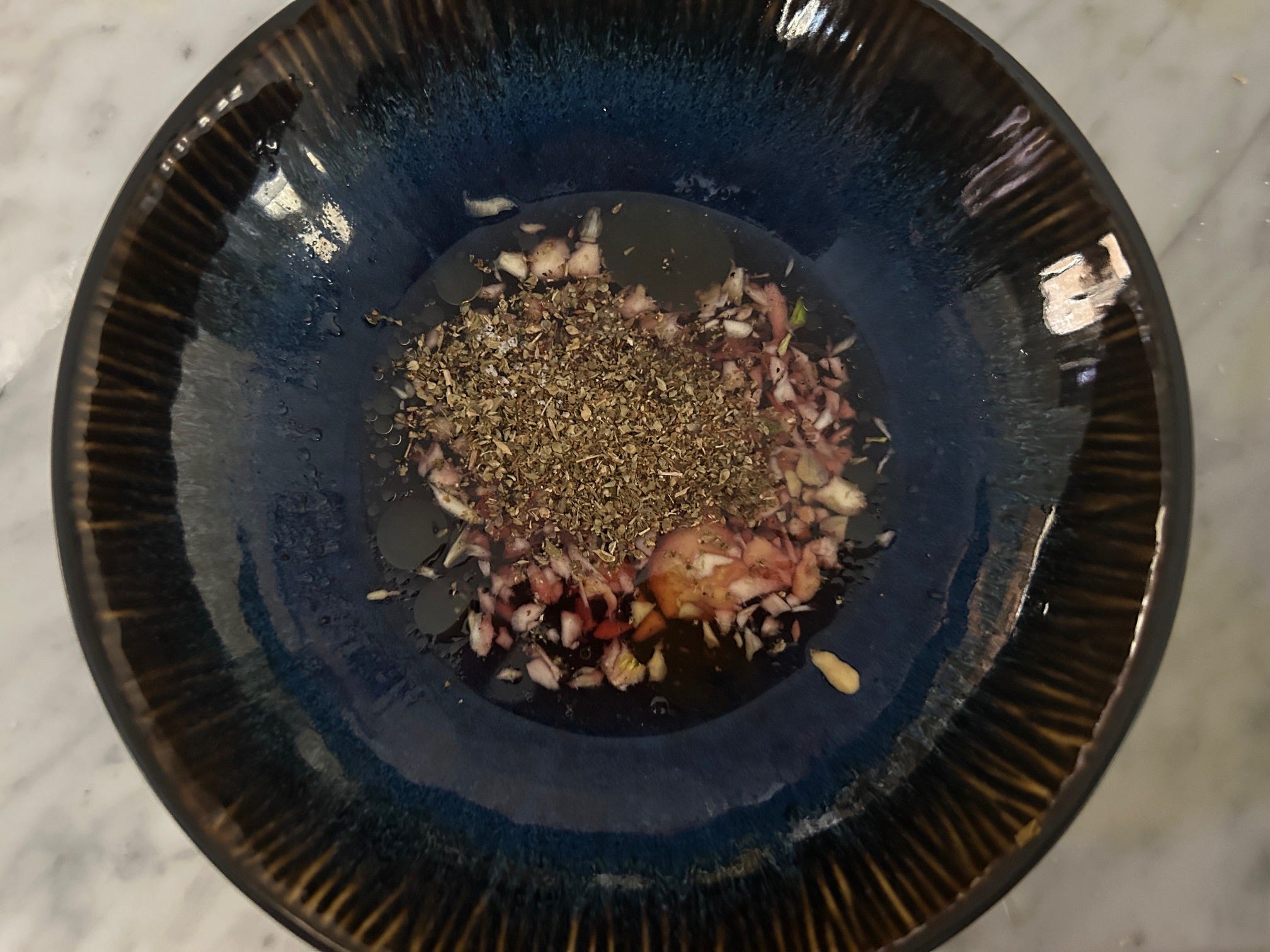 Making the dressing for Ina Garten's Greek panzanella salad