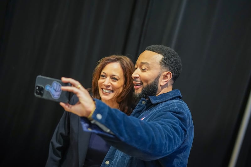 Democratic presidential nominee, U.S. Vice President Kamala Harris takes a selfie with musician John Legend