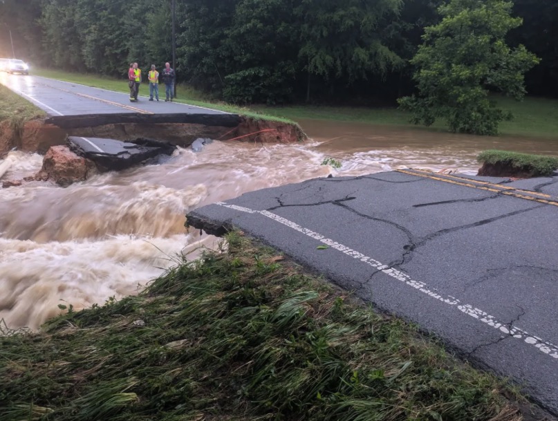 Road washed out by floodwaters near Chatham Central High School.