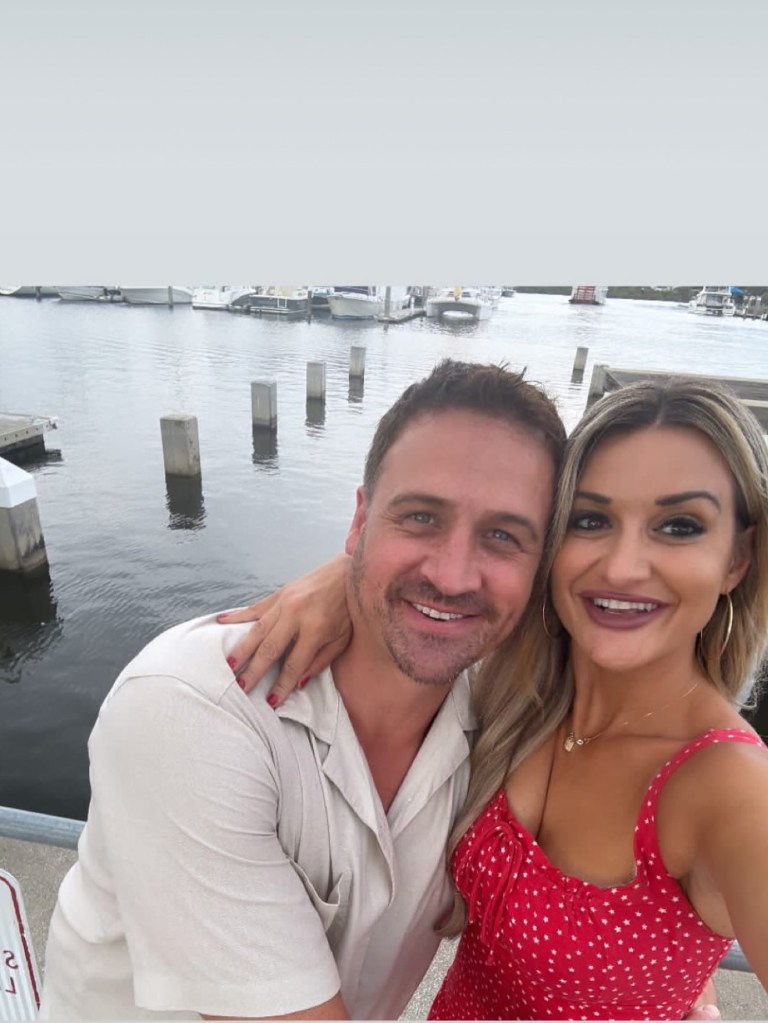 Ryan Lochte and Molly Gillihan taking a selfie.