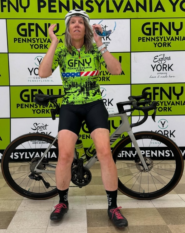 Kate KJ Phillips, a transgender athlete, with her bicycle.