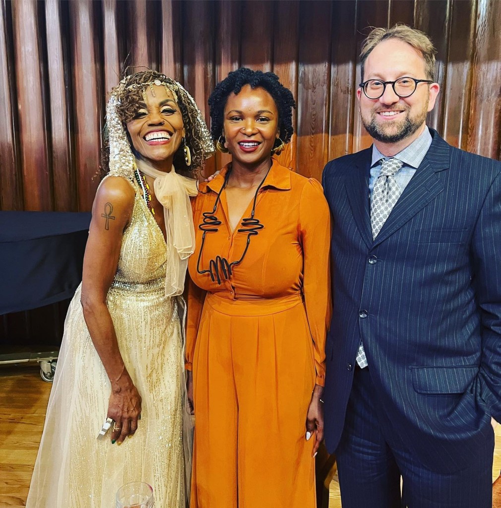 Sade Perkins (C) pictured with her partner Rev. Dr. Colin Bossen (R)