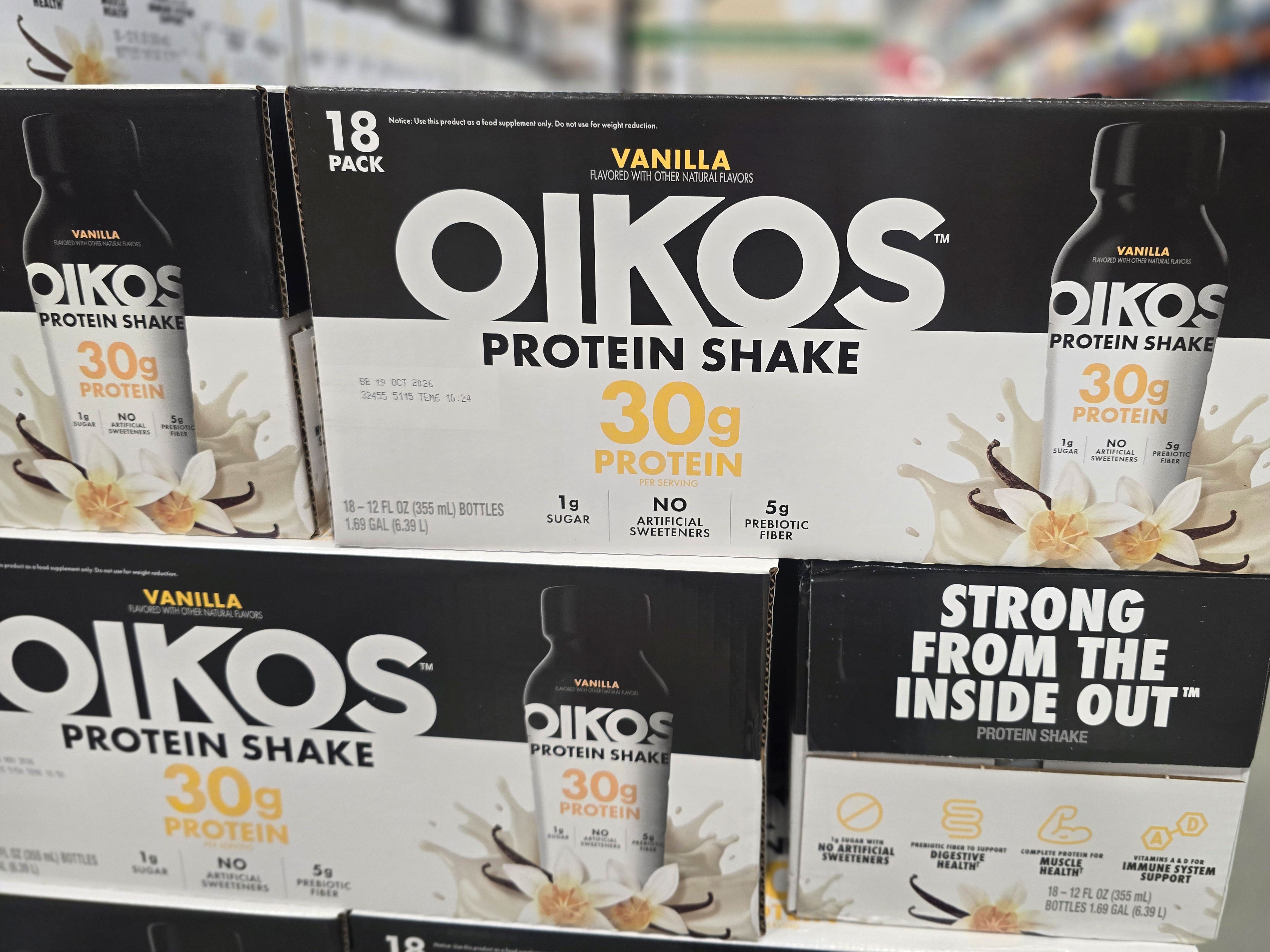 Boxes of Oikos vanilla protein shakes.