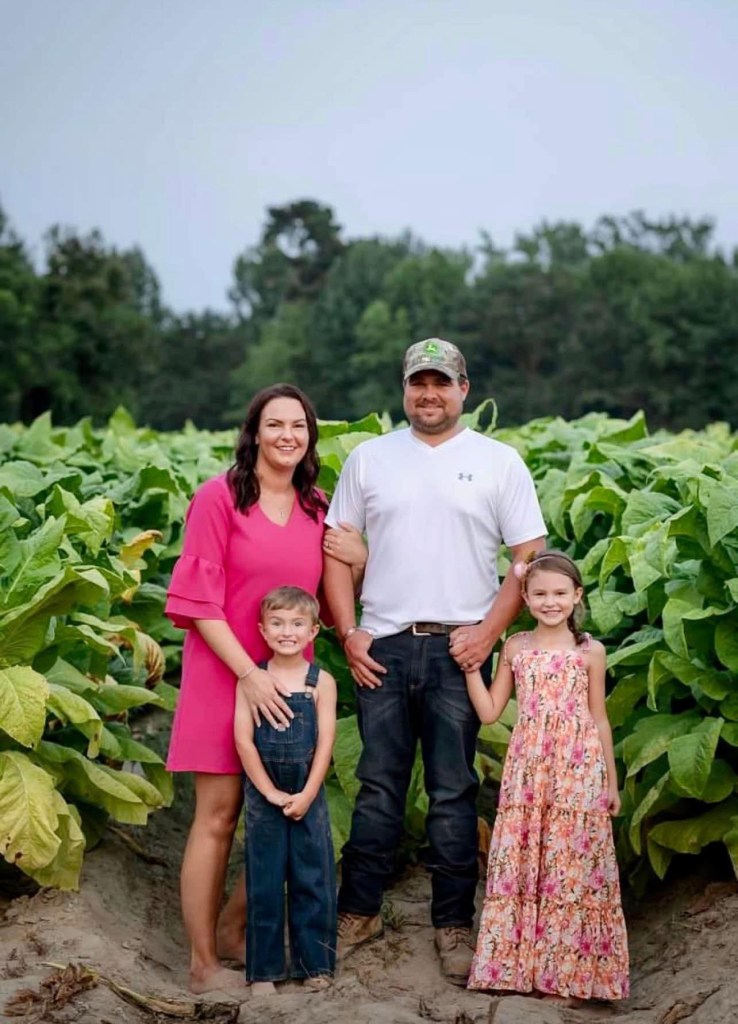 Family portrait in a tobacco field.