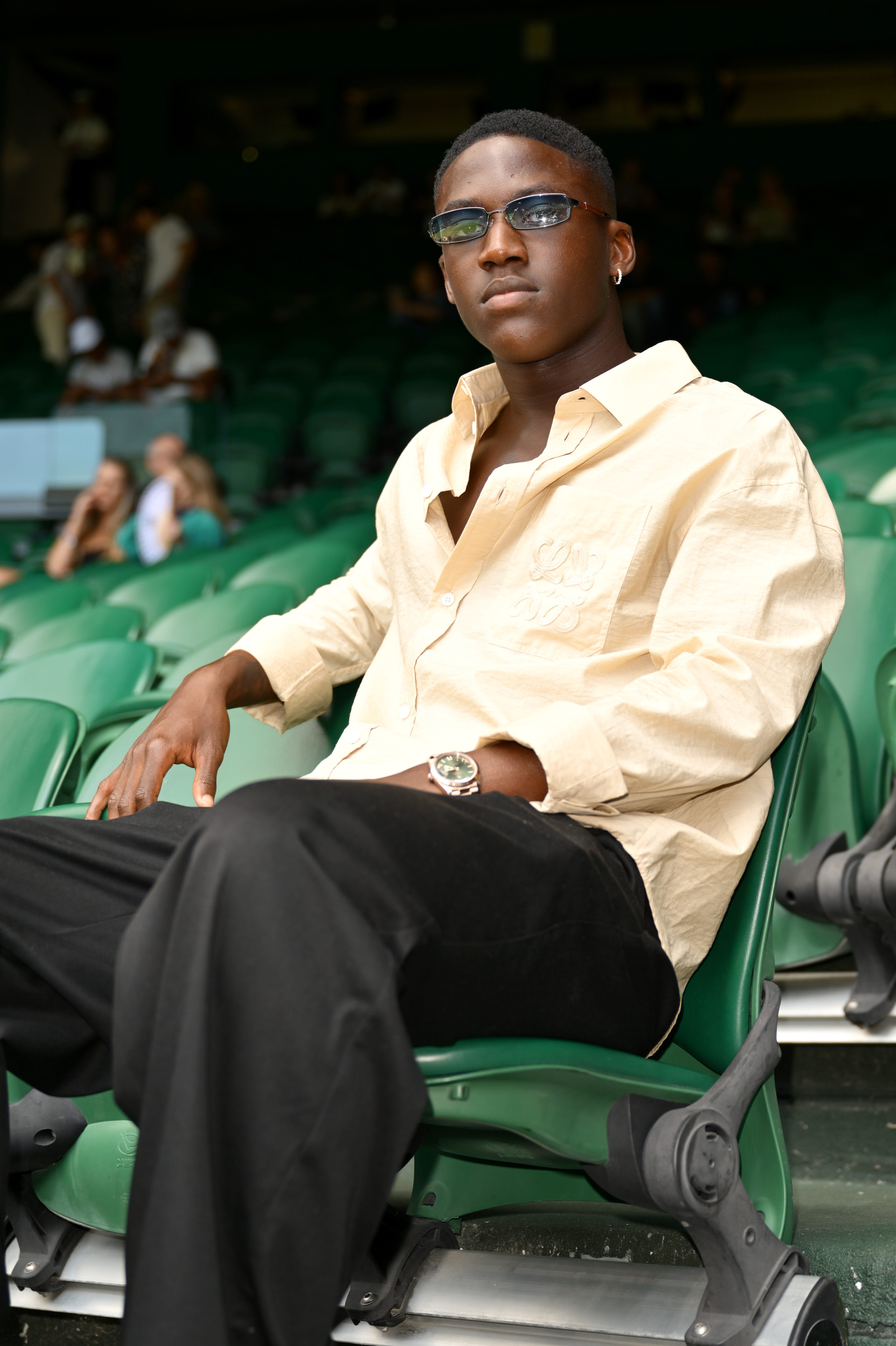 Kobbie Mainoo attends Wimbledon in July 2025.