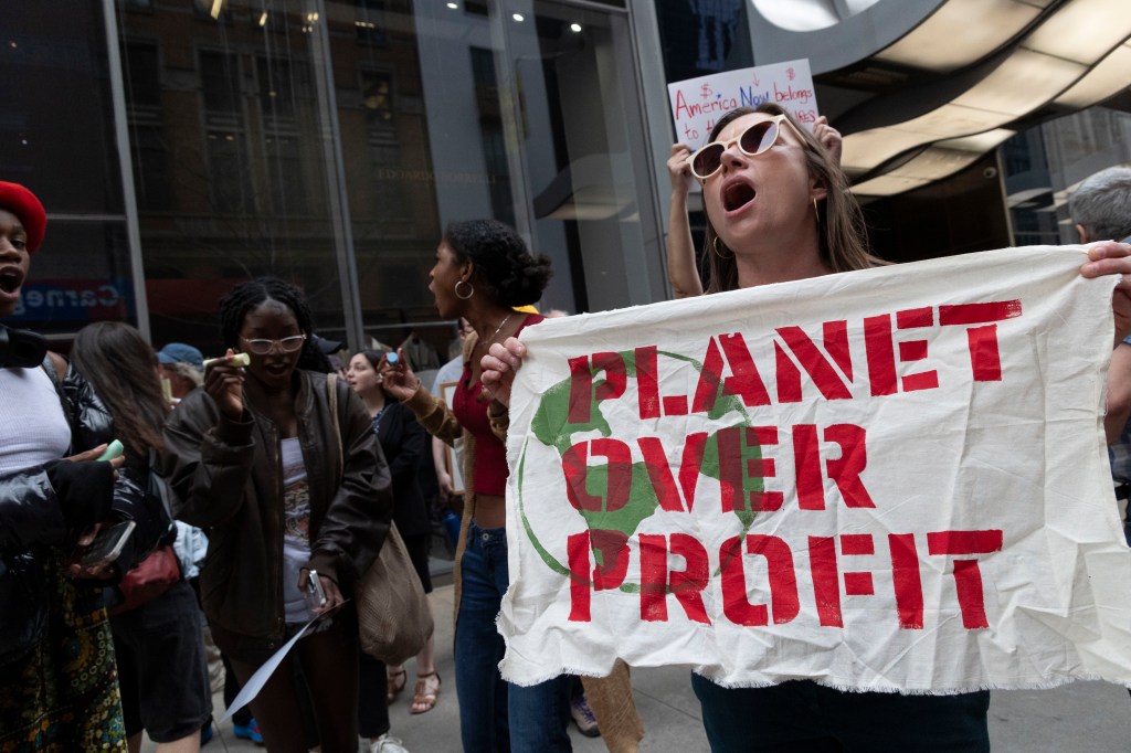 Protestors on Billionaires' Row holding a 