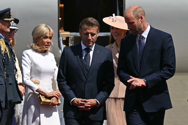 WINDSOR, ENGLAND - JULY 8: France's President Emmanuel Macron (2nd L) and his wife Brigitte Macron (L) are greeted by Prince William, Prince of Wales (R) and Catherine, Princess of Wales (2nd R) upon arrival at RAF Northolt on July 8, 2025 in Windsor, England. President Emmanuel Macron and Mrs Brigitte Macron visit the UK in the first visit State Visit made by France in 17 years. They are staying at Windsor Castle, hosted by King Charles III and Queen Camilla, and a banquet will be held there in their honour. The Macrons will visit Imperial College, and the President will address Parliament during his stay. (Photo by Justin Tallis - WPA Pool/Getty Images)