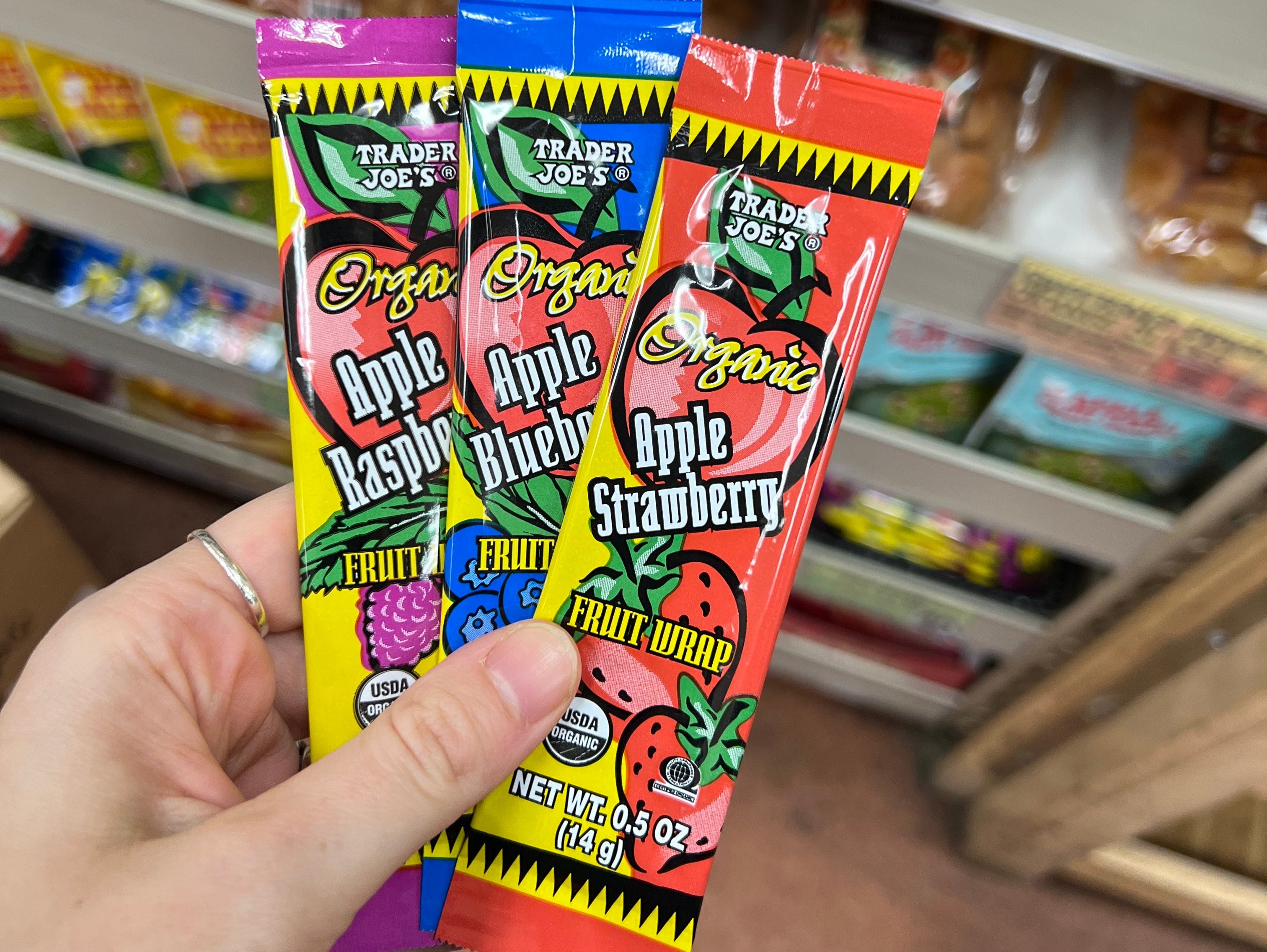 The writer holds packaged fruit strips