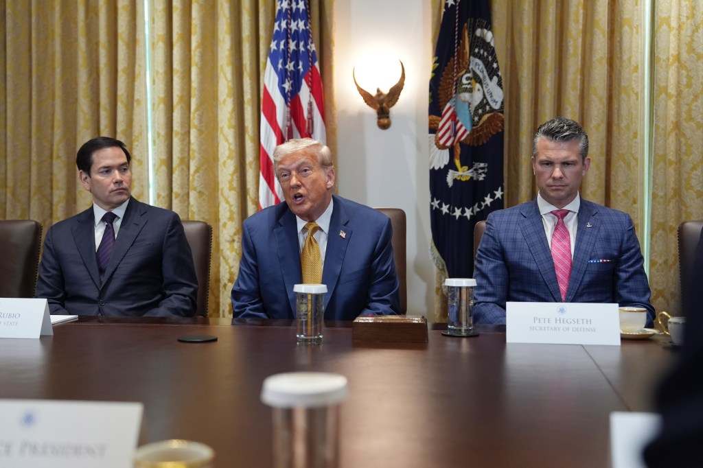 Donald Trump speaking at a cabinet meeting with Marco Rubio and Pete Hegseth.