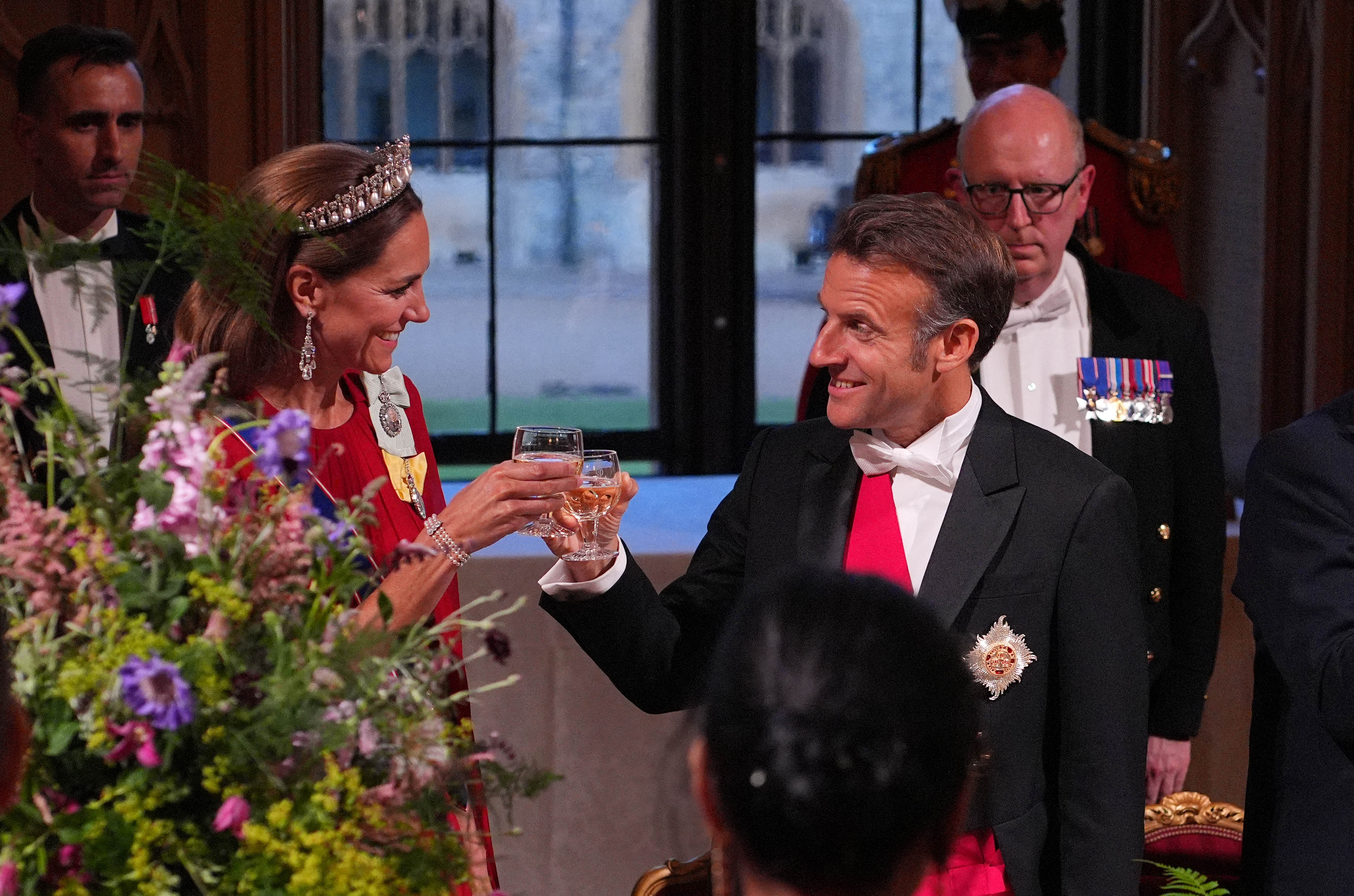 Kate Middleton toasting President Emmanuel Macron. 
