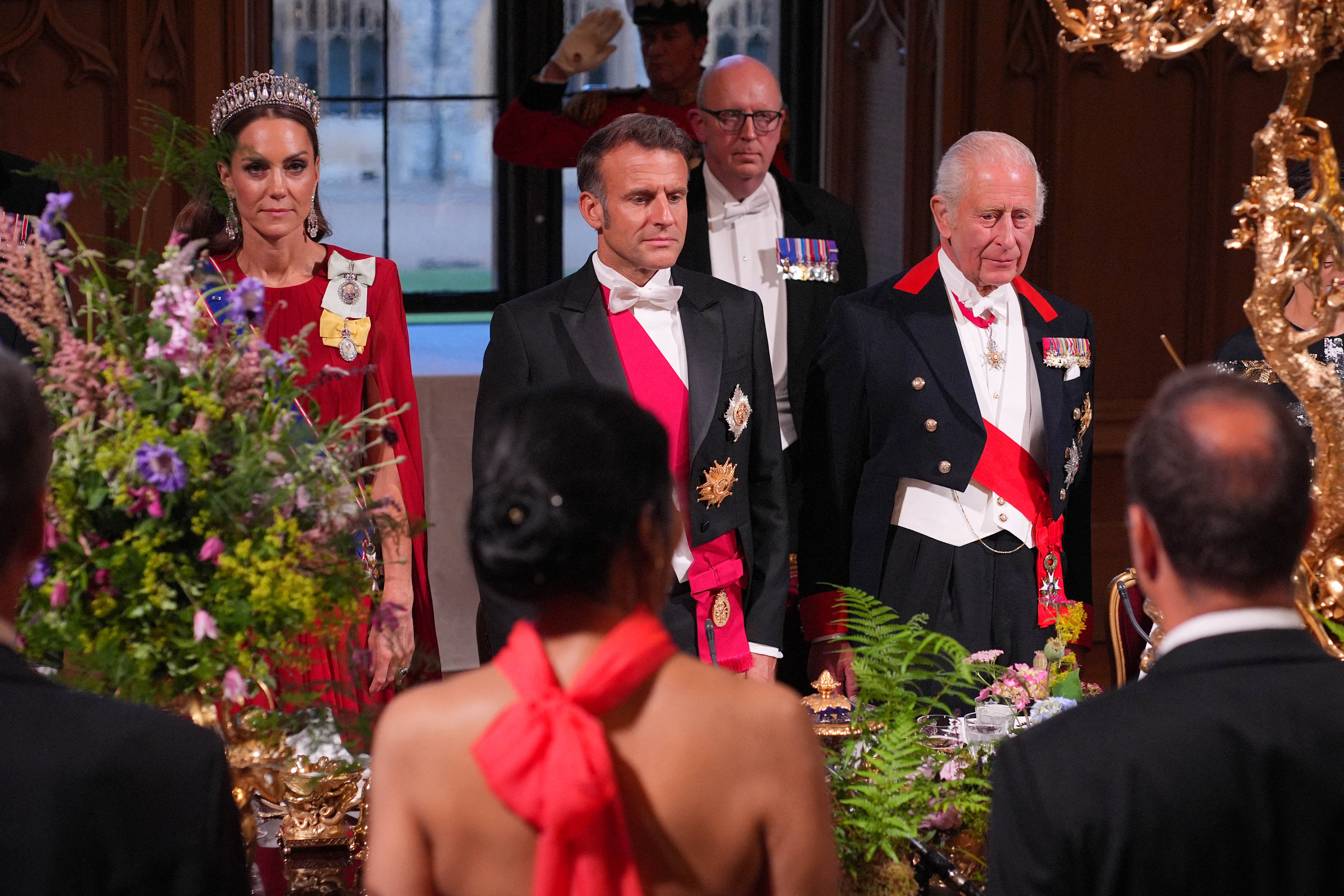 Kate Middleton, Emmanuel Macron, and King Charles at a royal event. 