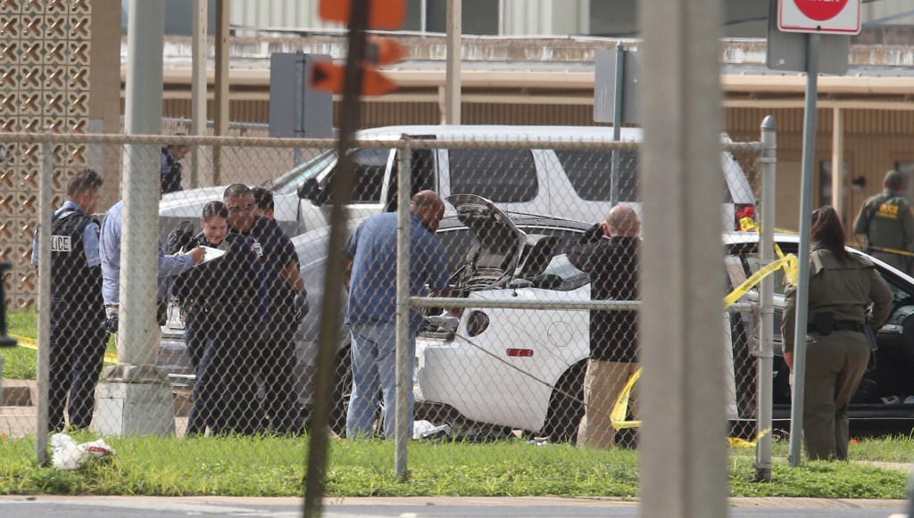 Law enforcement officers at a crime scene investigation.