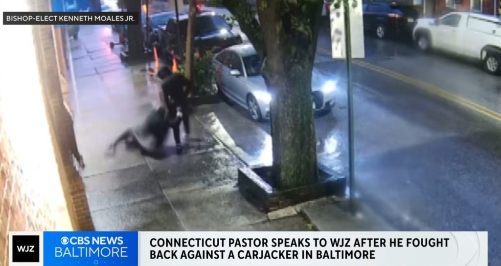 Security camera footage of a pastor fighting back against a carjacker.