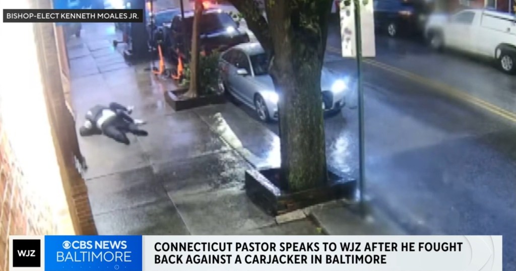 Security camera footage of a pastor fighting a carjacker.