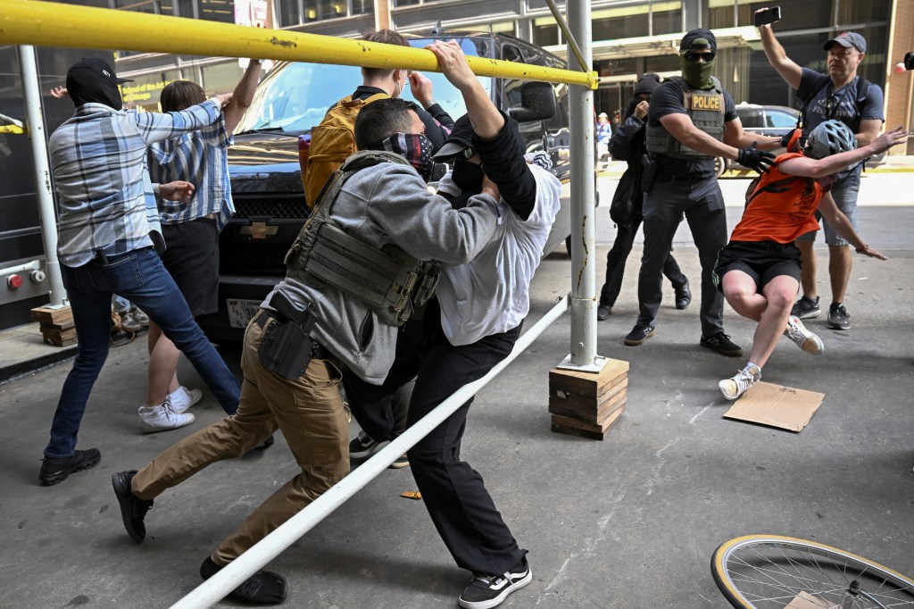 Federal agents arrest protesters who were blocking ICE agents outside a building on June 16, 2025.