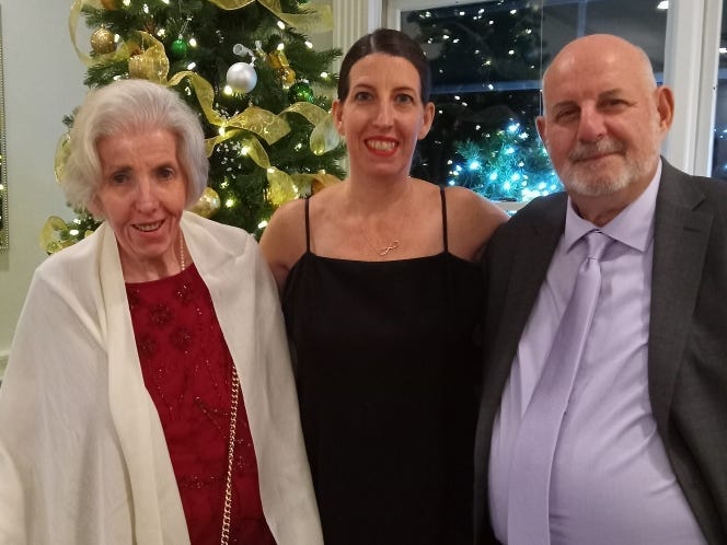 Katie Asturizaga with her parents.