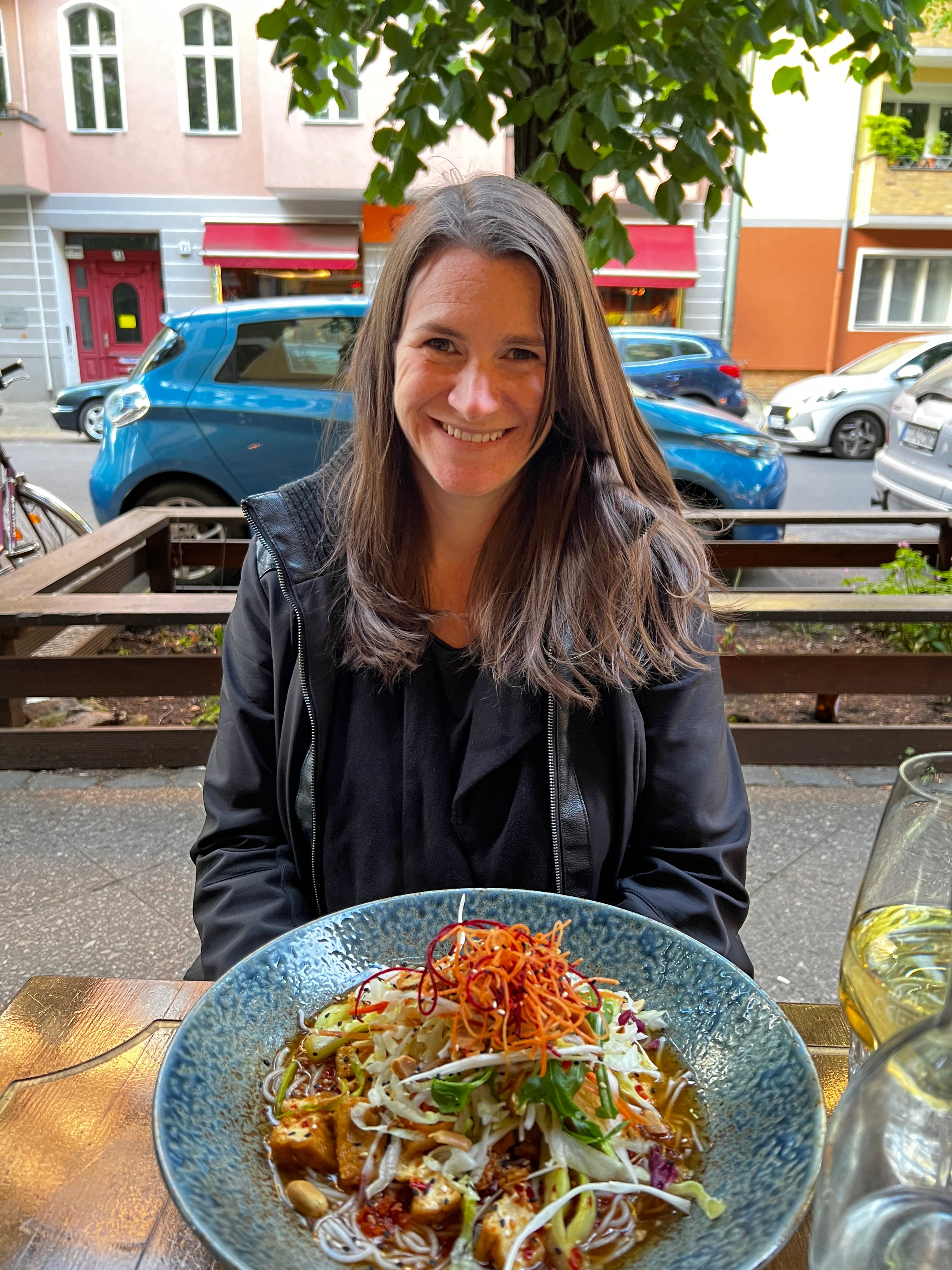Kate Chrisman with asian style food at a restaurant