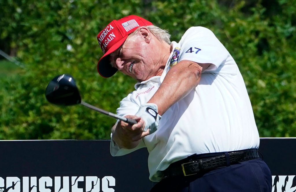 President Donald Trump hits a tee shot ahead at Trump National Golf Club in Bedminster, New Jersey on Aug. 9, 2023.