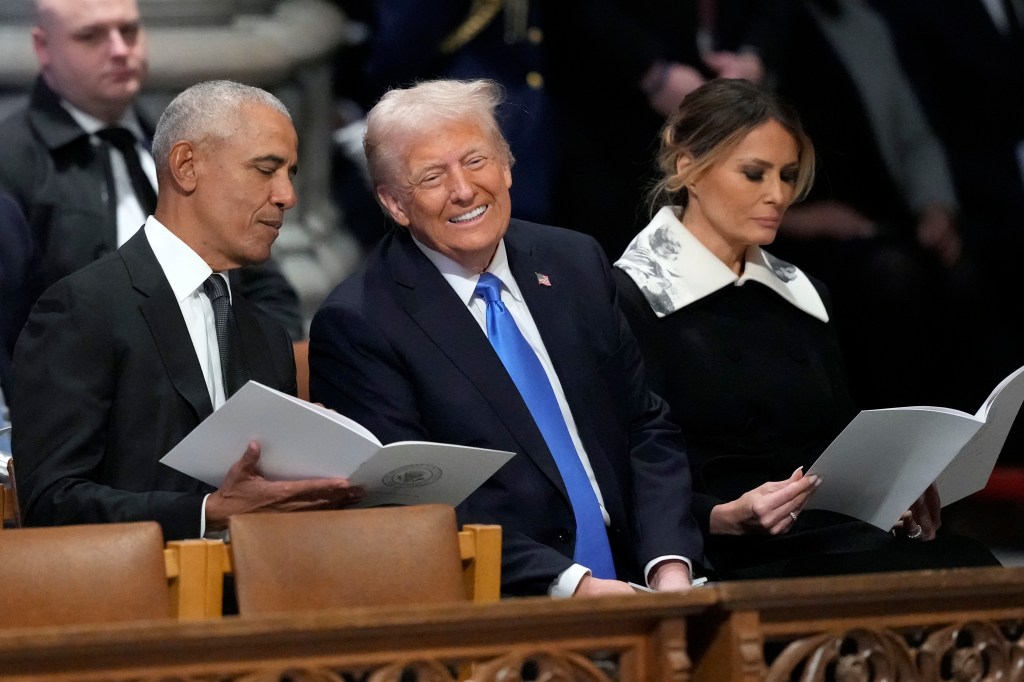 President Donald Trump sits next to President Barack Obama and former first lady Melania Trump inside Washington National Cathedral on Jan. 9, 2025.