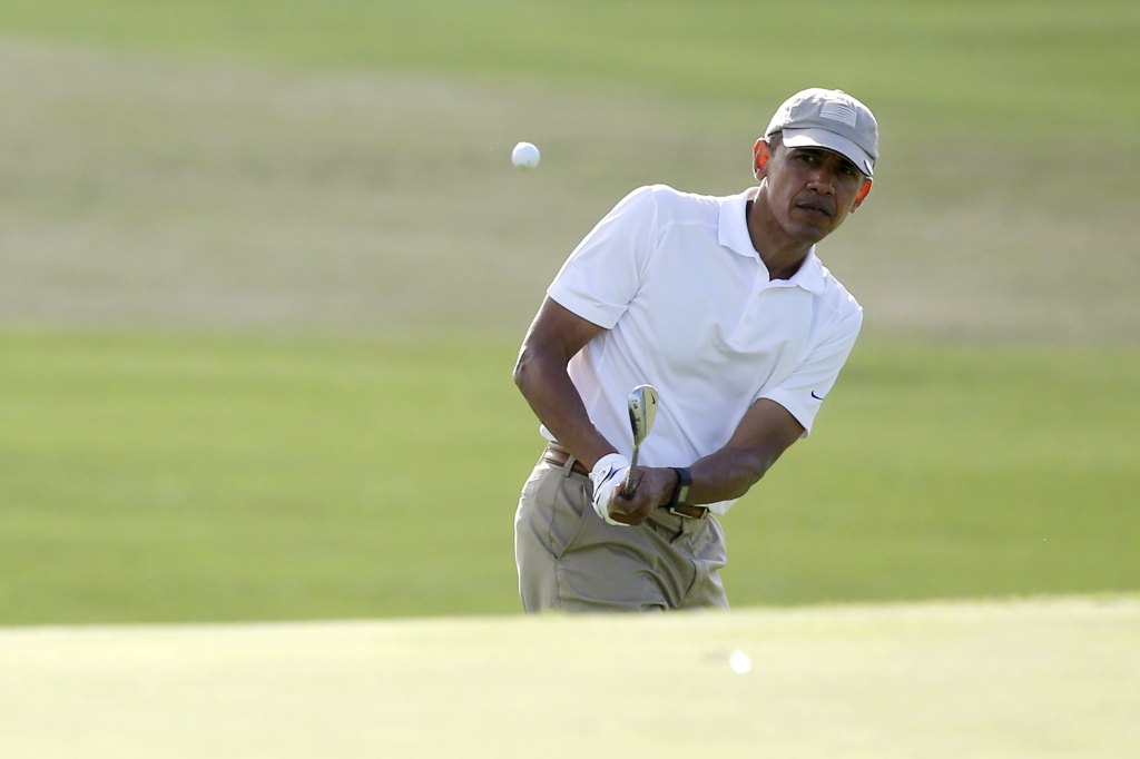 President Obama plays a shot to the 18th green at the Mid-Pacific Country Club in Kailua, Hawaii on Dec. 28, 2015.