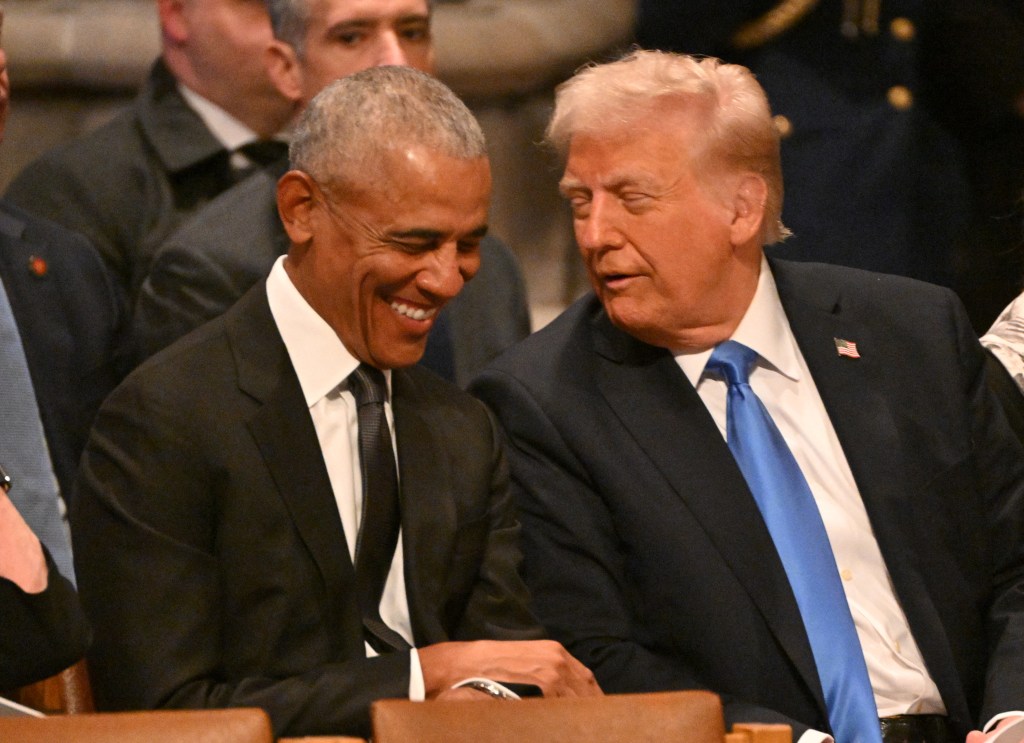Former President Barack Obama smiles as he talks with President-elect Donald Trump at former President Jimmy Carter's Funeral on Jan. 9, 2025.
