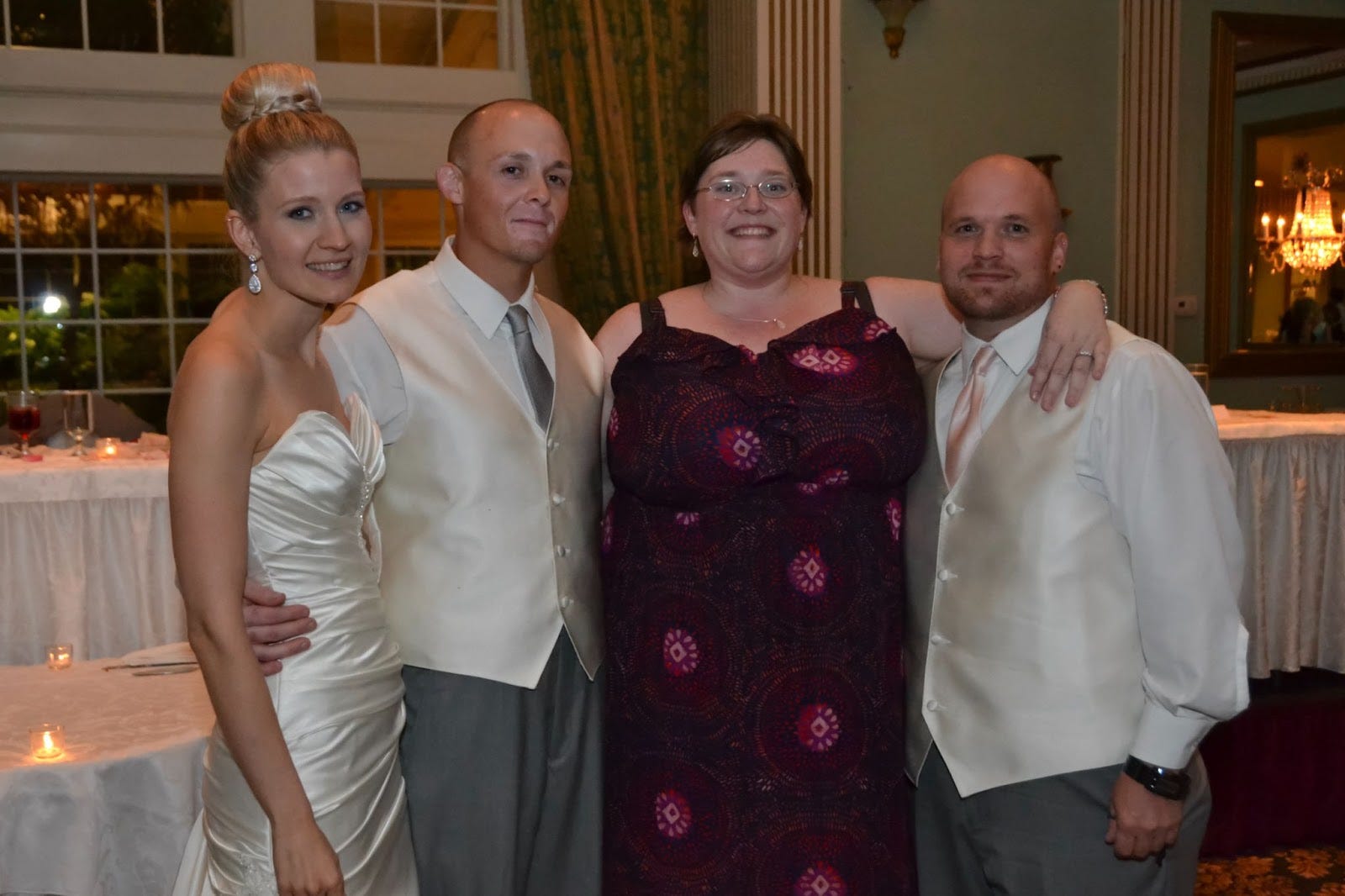 Author Stacey Manganelli with her husband and two friends at a wedding