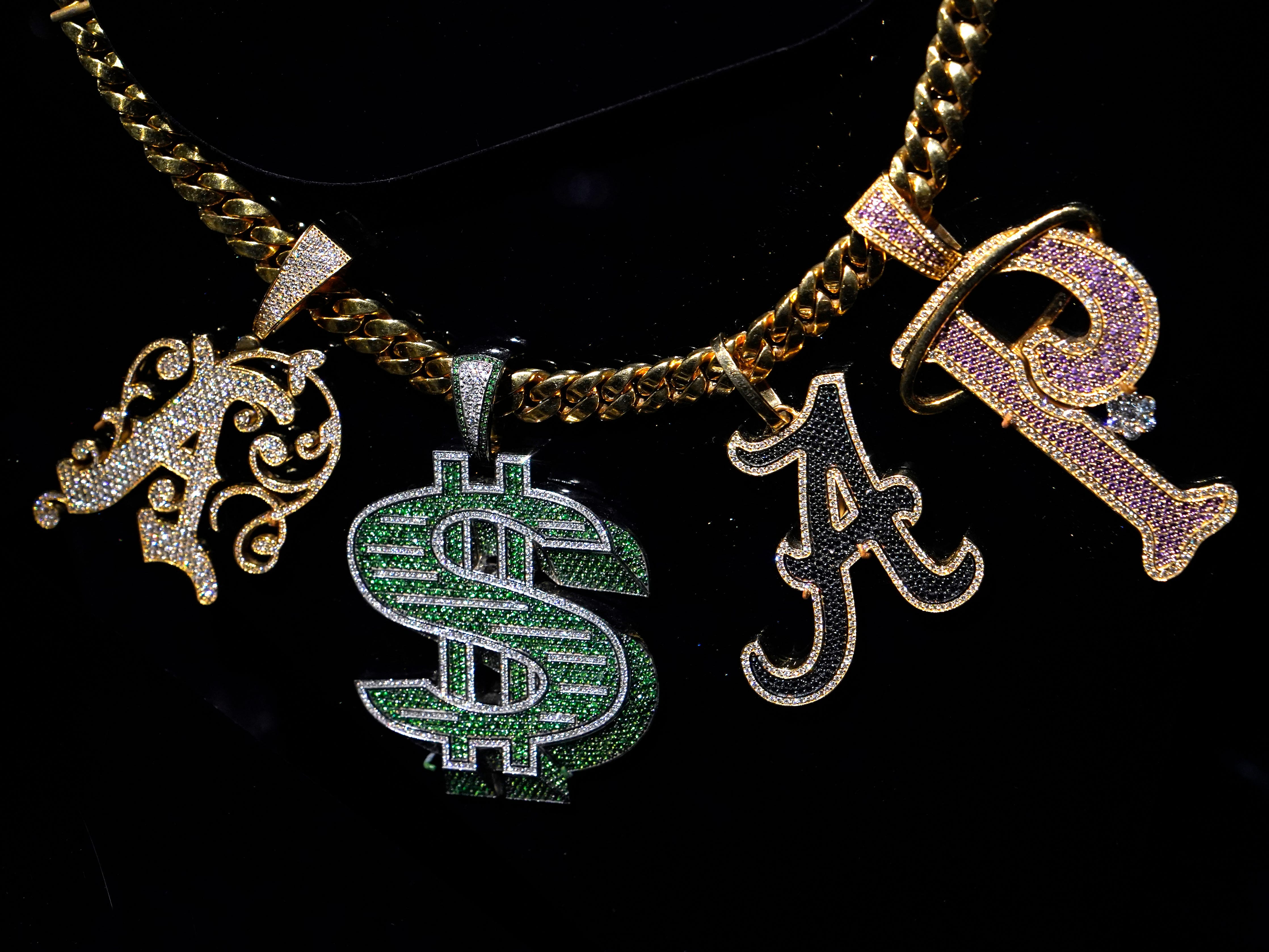 close up of asap rockey's nameplate necklace