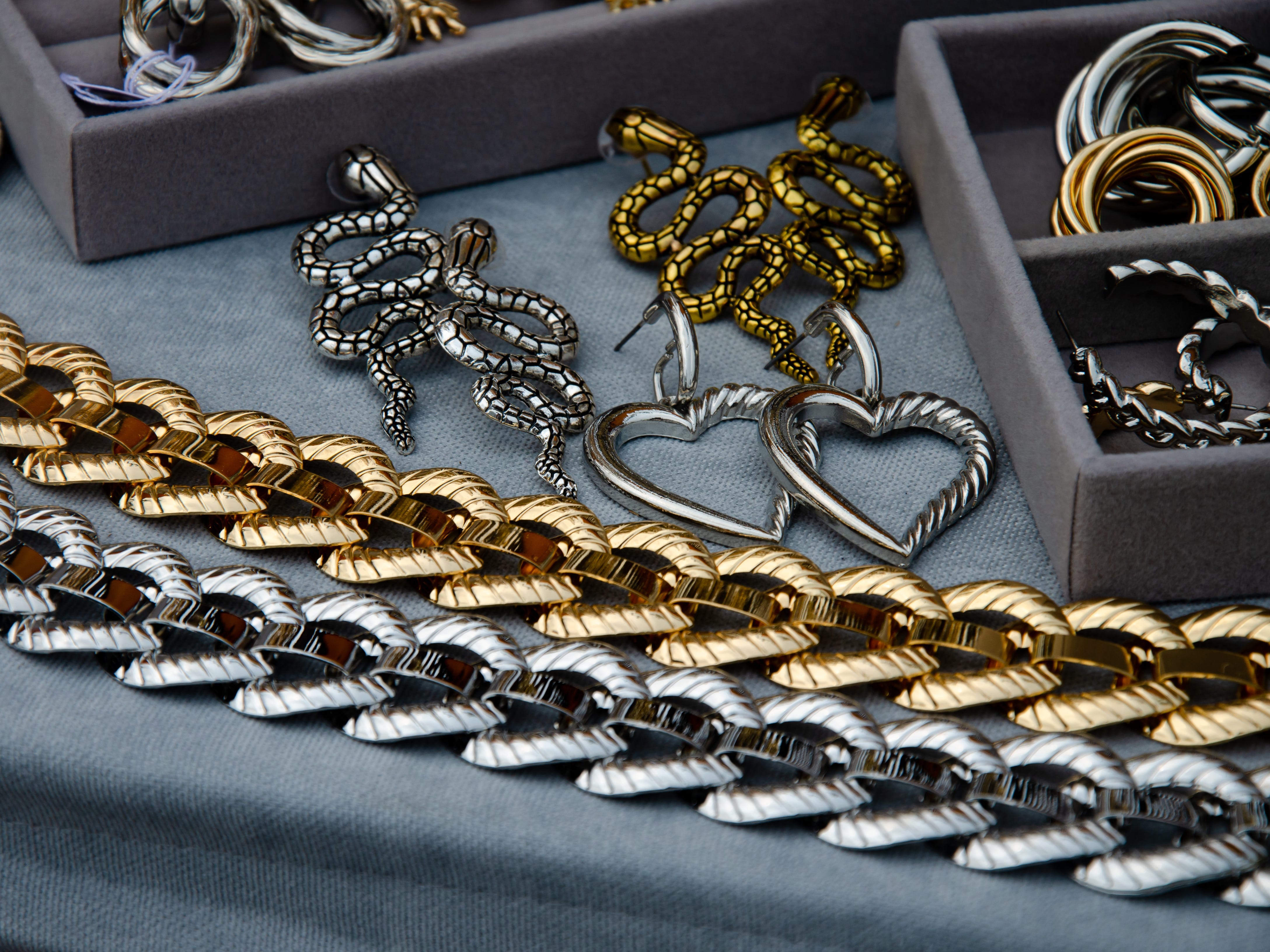 tray of silver and gold jewelry