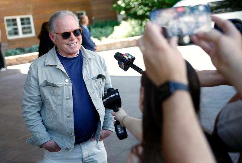 Warner Bros. Discovery CEO David Zaslav donned red sunglasses and a denim on denim look as he chatted with reporters at the conference.