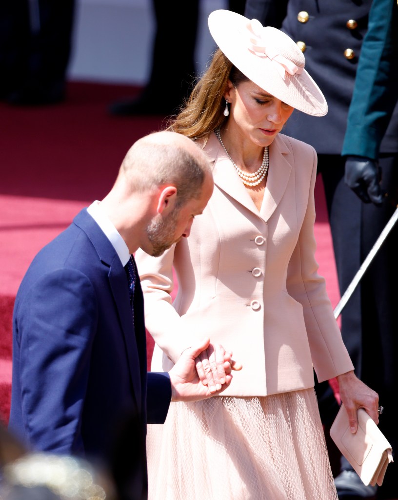 WINDSOR, UNITED KINGDOM - JULY 08: (EMBARGOED FOR PUBLICATION IN UK NEWSPAPERS UNTIL 24 HOURS AFTER CREATE DATE AND TIME) Prince William, Prince of Wales and Catherine, Princess of Wales hold hands as they descend the Royal Dais, Datchet Road, following the formal welcome for French President Emmanuel Macron and Brigitte Macron on day one of their State Visit to the United Kingdom on July 8, 2025 in Windsor, England. President Emmanuel Macron and Mrs Brigitte Macron visit the UK in the first visit State Visit made by France in 17 years. They are staying at Windsor Castle, hosted by King Charles III and Queen Camilla, and a banquet will be held there in their honour. The Macrons will visit Imperial College, and the President will address Parliament during his stay. (Photo by Max Mumby/Indigo/Getty Images)