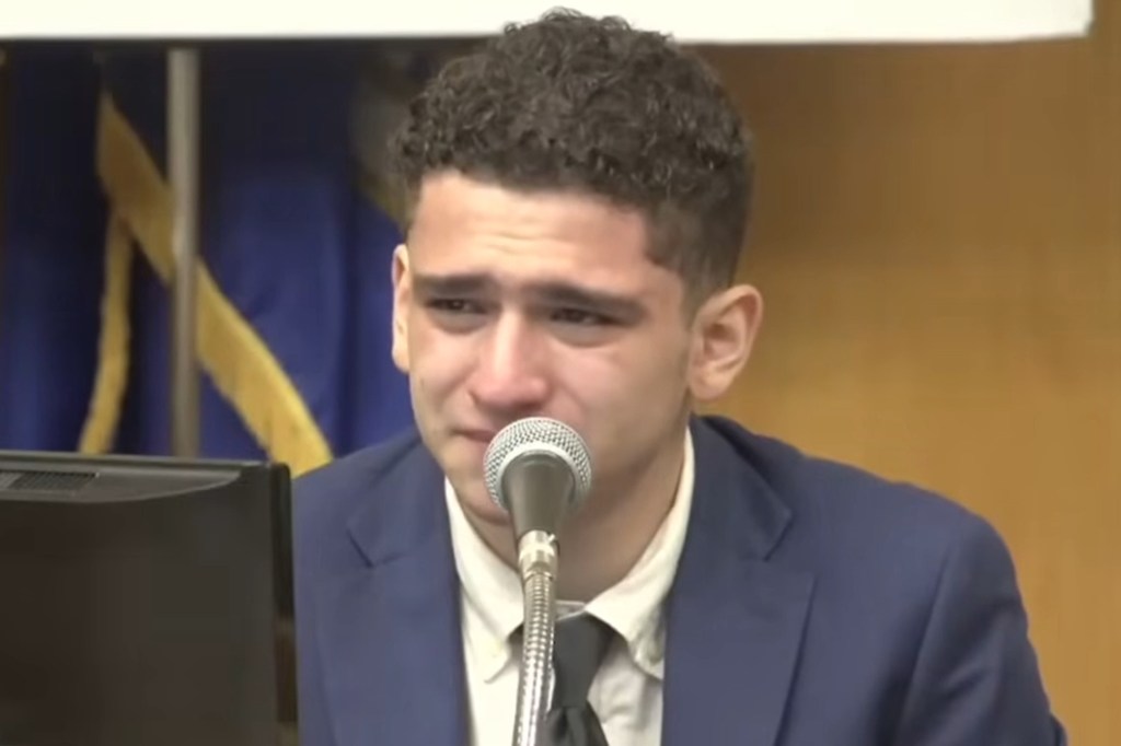 Raul Valle testifying, crying at a microphone.