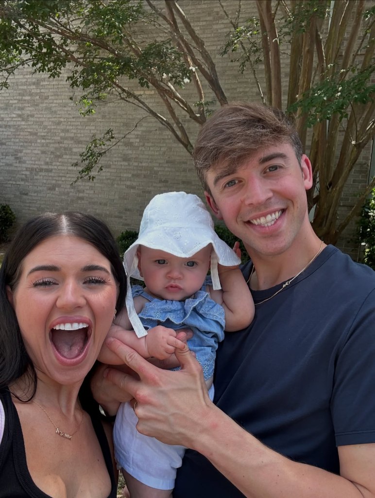 Madi Prewett and Grant Troutt taking a selfie with their daughter, Hosanna.