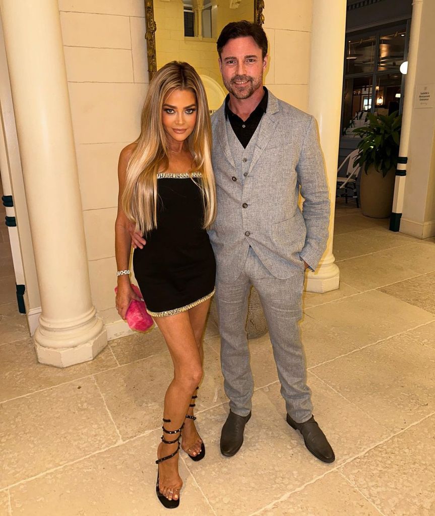 Denise Richards and Aaron Phypers pose together.