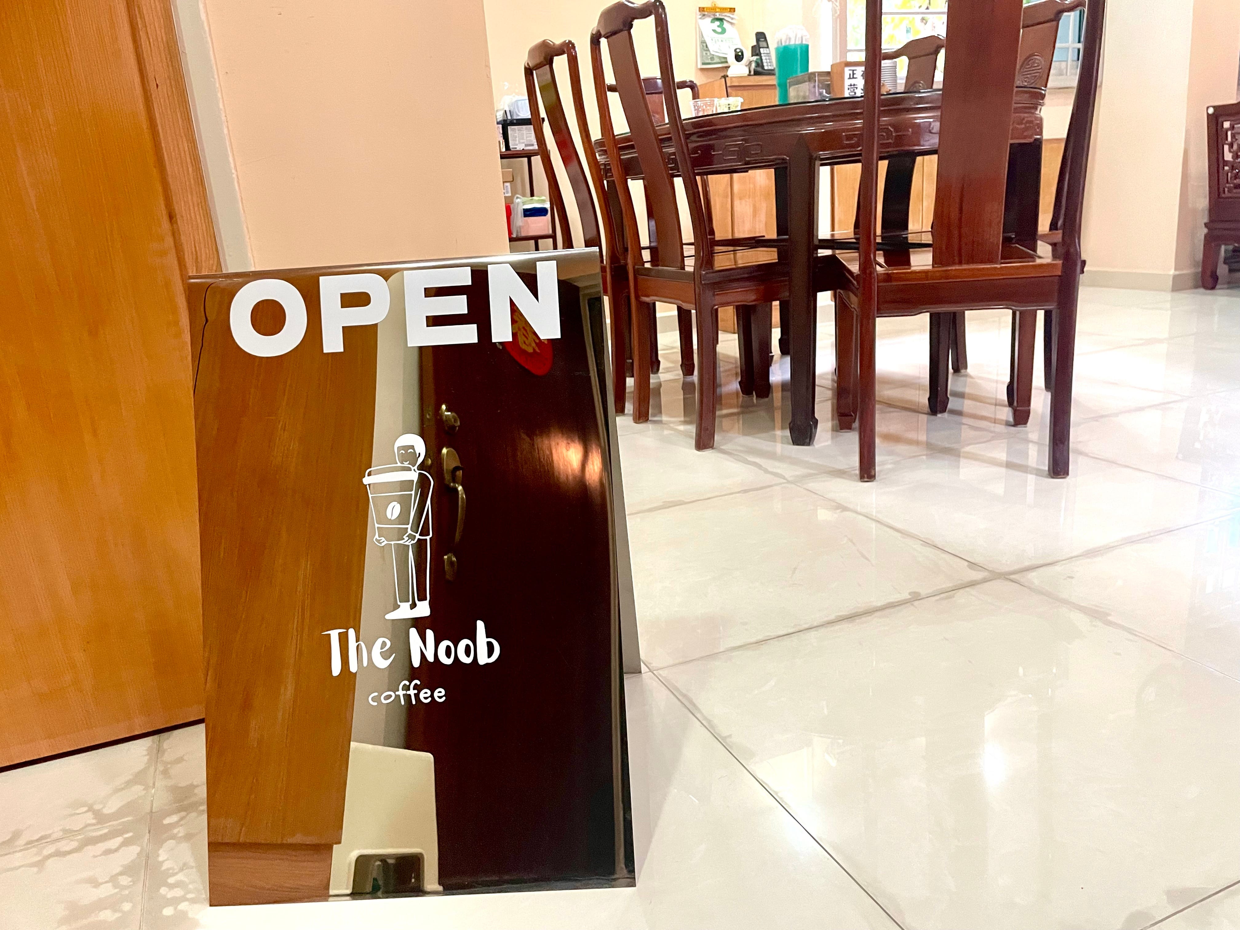 A small metal sign at the entrance of Chia's flat welcomes guests.