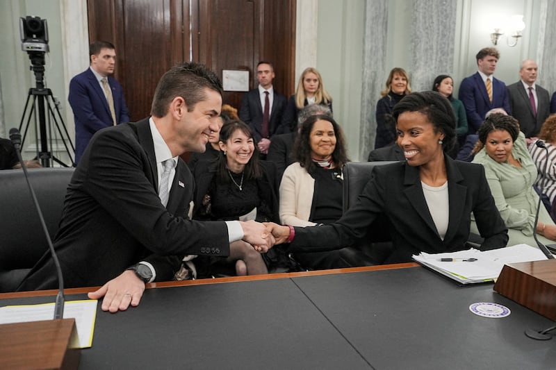 FILE PHOTO: Jared Isaacman, U.S. President Donald Trump's nominee to be administrator of the National Aeronautics and Space Administration (NASA), shakes hands with Olivia Trusty, nominee to be a member of the Federal Communications Commission, before testifying during a Senate Commerce, Science, and Transportation confirmation hearing on Capitol Hill in Washington, D.C., U.S., April 9, 2025. REUTERS/Ken Cedeno/File Photo